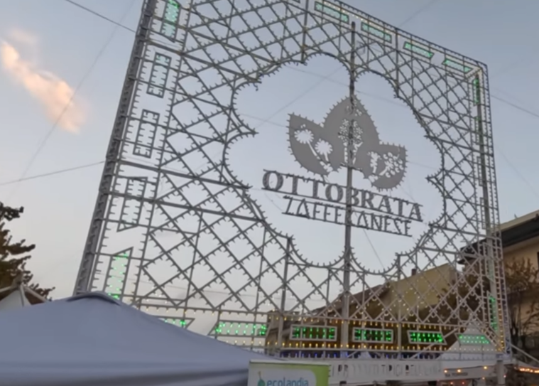 Illuminated Ottobrata Zafferanese sign in Zafferana Etnea, October 2025
